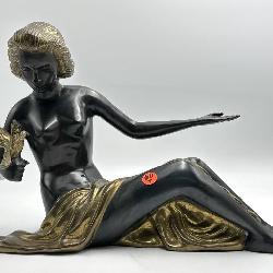 BRONZE SITTING NUDE WITH BIRD SCULPTURE;