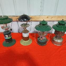 four Coleman lanterns