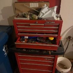 Craftsman red tool chest with assorted tools