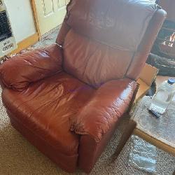 Brown leather recliner armchair with manual lever