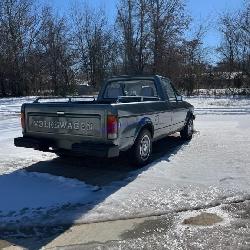 Volkswagen Caddy pickup truck, green, manual trans