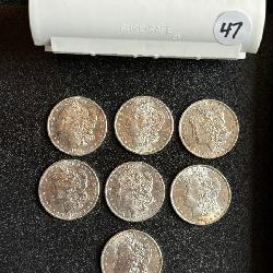 Lot# 47 (7) UNC Morgan Silver Dollars- 1880, 81, 83-85, 87 & 99