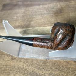 Carved bowl pipe with vulcanite stem
