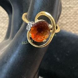 Gold Ring with Oval Amber-Colored Stone