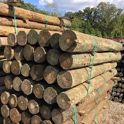 (24) 7” x 8’ PRESSURE TREATED WOOD FENCE POST