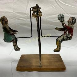 Tin Swing Toy with Painted Figures on Wood Base