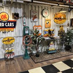 Extensive collection of automotive and petroleum advertising signs, air service equipment, oil cans,