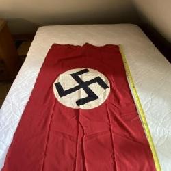 29 x 49 WWII NSDSP German flag with a hole in it.