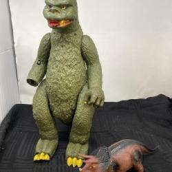 Dinosaur on wheels and battery operated dinosaur.