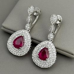A Pair of Platinum, Burmese Ruby, and Diamond Double-Halo Drop Earrings