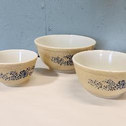 three Pyrex mixing bowls