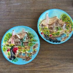Chalkware decorative plates featuring a 3D relief scene of a thatched English cottage