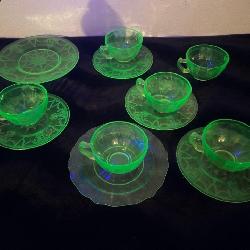 uranium glass mugs, saucers, and plate