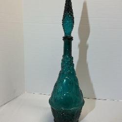 vintage blue-green glass genie bottle decanter with a fruit basket pattern
