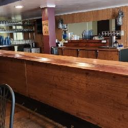  20' Bar with brass foot rail, with 8' L-shape off the end & 18