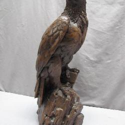 Hand-Carved Wooden Eagle Statue on Rock Base