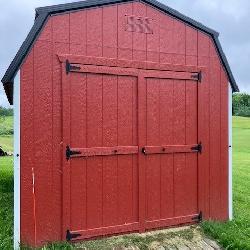 Like new 10x16 gambrel mini barn w/ dbl doors & loft
