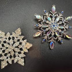 Two Snowflake Brooches, One Signed 'Sarah & Co’