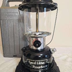 Coleman Model 290A Special Edition Powerhouse lantern with black fount, matching black ventilator, clear globe and adjustable light output control; marked 1/88. Includes molded Coleman carrying case a
