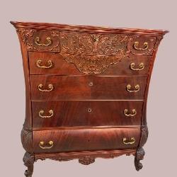 HEAVY CARVED KETTLE FORMED MAHOGANY TALL CHEST