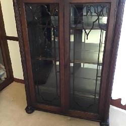 Glass front antique cabinet 