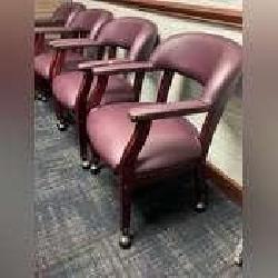 6 rolling leather chairs with maroon cushioning