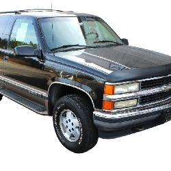 1995 Chevy Tahoe LT, 5.7 liter V8, 2-tone black/gold, 2 door, automatic, 4 wheel drive, tilt, cruise, a/c, power seats, alum. wheels, running boards, toe hitch, odo reads 67k believe original