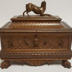 1058	OUTSTANDING CARVED DRESSER BOX WITH CARVED LIONS HEADS, PAW FEET AND CROUCHED DOG AT LID TOP, APPROXIMATELY 11 IN X 6 IN X 10 IN H