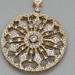 An Art Deco Snowflake design 14k Gold and diamond pendant with 14k Gold necklace. 6.32 grams in TW.