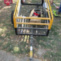 Large yellow and black garden cart on wheels, folds down for easy storage, pull behind