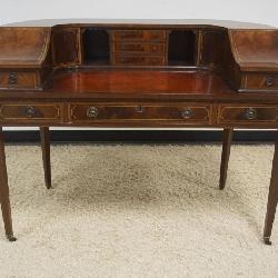 NICE FLAMED MAHOGANY CARLTON DESK WITH BANDED DRAWER FRONTS AND PENCIL INLAY, INSET LEATHER TOP WRITING SURFACE, APPROXIMATELY 50 IN X 26 IN X 38 IN H