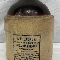 2g. E.A. Lackey Glazed Stoneware Jug with Advertising Label