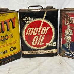 Three Vintage Two-Gallon Motor Oil Cans: Unity, Wearwell, and Defender