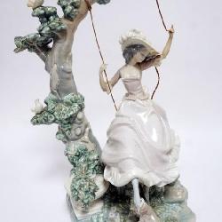 1075	LLADRO PORCELAIN FIGURE *VICTORIAN GIRL ON SWING* ROPE SEPARATED ON RIGHT SIDE, APPROXIMATELY 17 IN HIGH