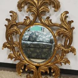 1122	LARGE CONTEMPORARY CARVED WOOD BEVELED EDGE MIRROR WITH GILT FINISH, MARKED ON BACK DAUPHONE HARRISON & GIL, APPROXIMATELY 37 IN X 49 IN H
