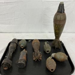 8 Inert WW2 Ordnance Items on Black Tray