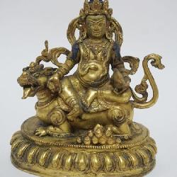 1002	GILT METAL FINISHED BUDDHA FIGURE WITH SERPENT, APPROXIMATELY 7 IN X 8 IN
