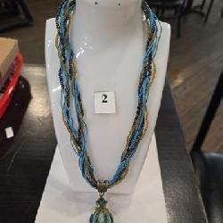 Beaded and string necklace with blue gem stone