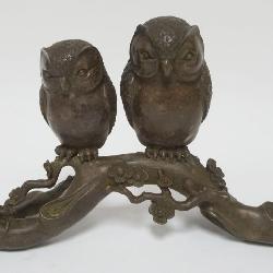 1018	BRONZE OWLS PERCHED ON BRANCH, APPROXIMATELY 12 IN X 4 IN X 8 IN HIGH