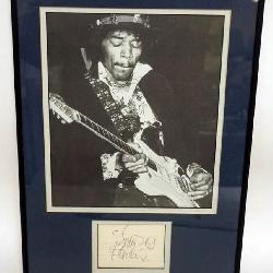 1139	JIMI HENRIX FRAMED & MATTED IMAGE W/ATTRIBUTED SIGNATURE, APPROXIMATELY 13 IN X 17 IN OVERALL