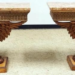 1143	PAIR OF MARBLE TOP CONSOLES WITH CARVED FALCONS AT BASE, EACH APPROXIMATELY 43 IN X 16 IN X 34 IN H