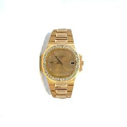 Lot #8293 Patek Philippe Yellow Gold Nautilus Watch with Diamonds