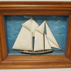 1055	HALF HULL OF SAILING SHIP IN SHADOW BOX FRAME, APPROXIMATELY 28 IN X 21 IN OVERALL
