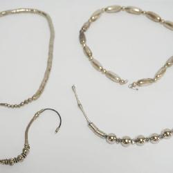 1052	ASSORTMENT OF 4 LADIES SILVER TONE NECKLACES