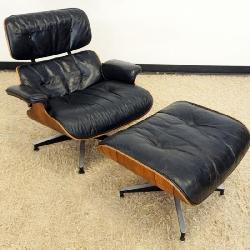 1194	HERMAN MILLER EAMES LOUNGE CHAIR AND OTTOMAN, SOME WEAR TO LEATHER, CHAIR APPROXIMATELY 34 IN X