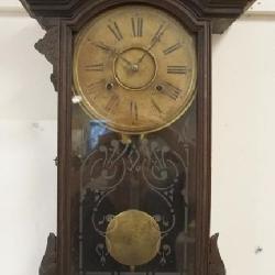 1224	VICTORIAN WALL CLOCK IN CARVED WALNUT CASE, APPROXIMATELY 13 IN X 5 IN X 29 IN