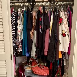 One of many closests full of lightly worn stylish clothes