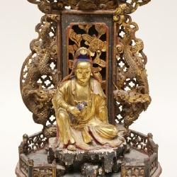 1012	INTRICATE CARVED WOOD ASIAN GILT FIGURE IN TEMPLE LIKE SETTING, APPROXIMATELY 17 IN HIGH, SOME 