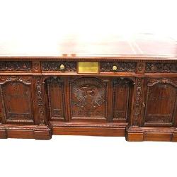 Lot 100: Fantastic Resolute Presidential Desk hand carved in the solid mahogany, leather top, carved with the United States Seal, Replica of the original John F. Kennedy's desk with photos and history
